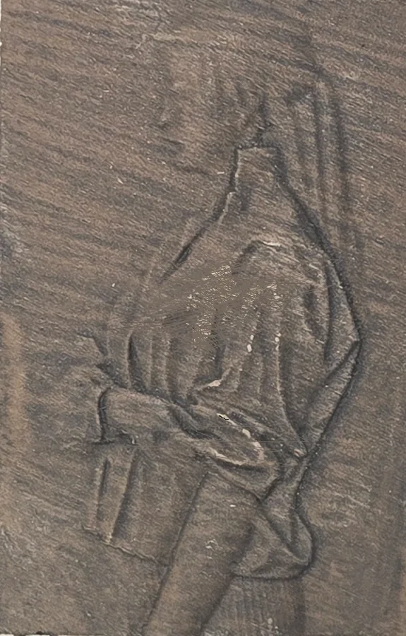 The Driftwood finish on a finished Tazbear relief of a robed figure with clasped hands