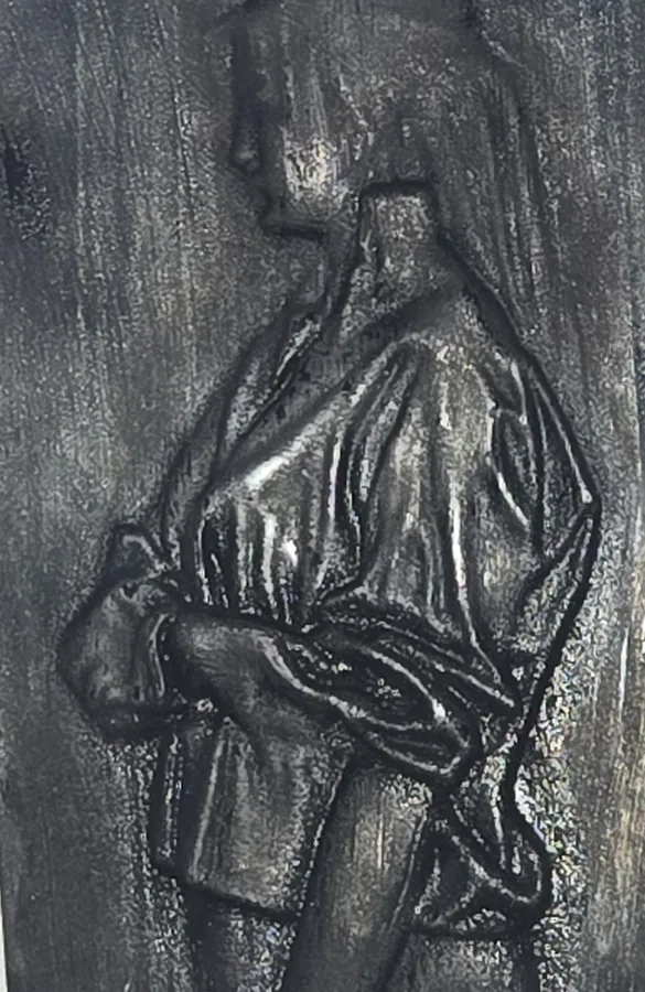 The Midnight finish on a finished Tazbear relief of a robed figure with clasped hands