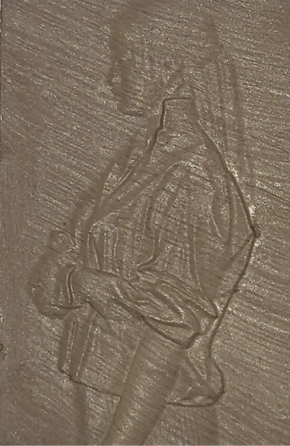 The Willow finish on a finished Tazbear relief of a robed figure with clasped hands